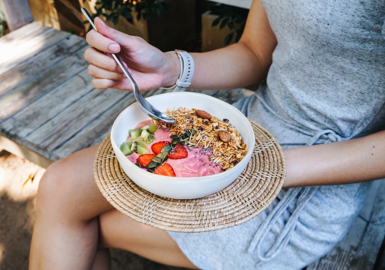 Woman Eating Healthy Smoothie Bowl